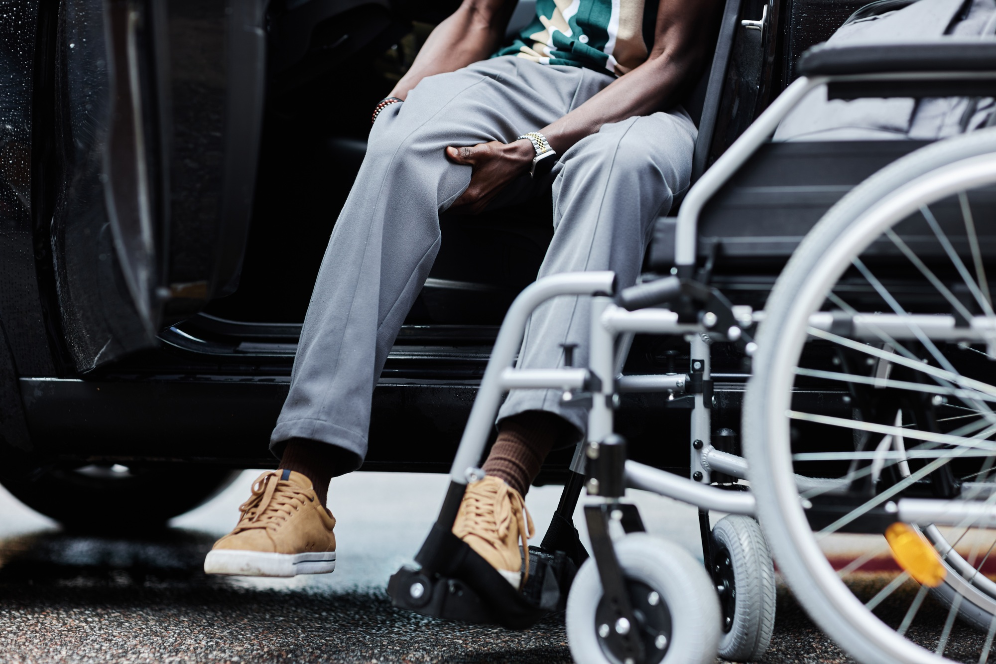 Man with Disability Entering Car