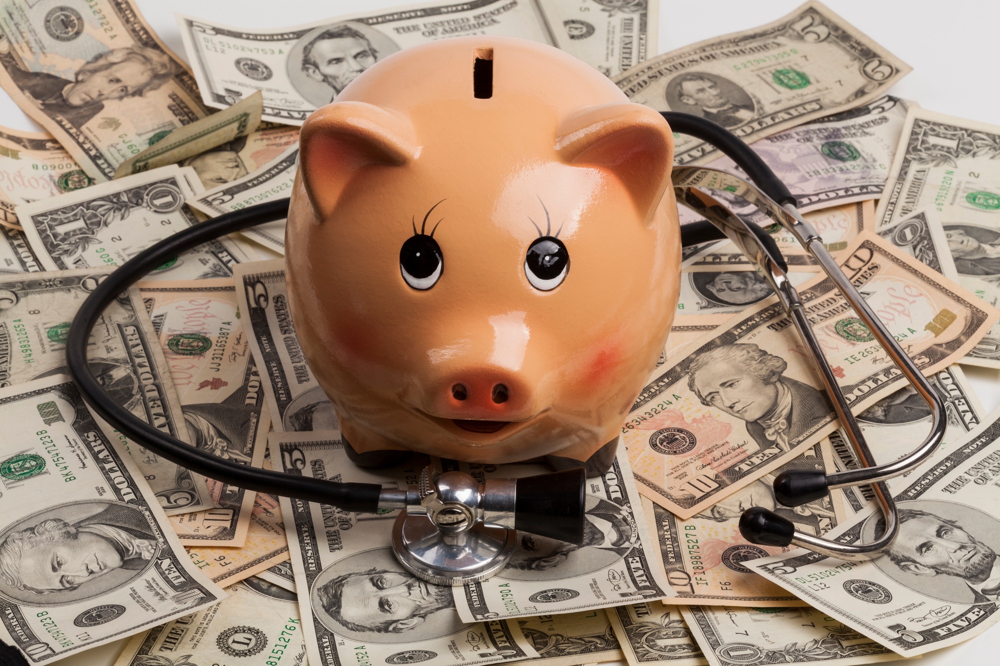 Piggy Bank and Stethoscope on Dollars